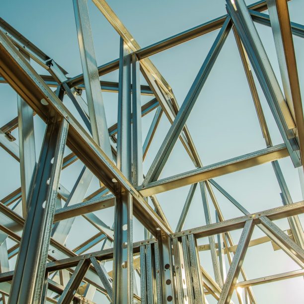 Building Steel Skeleton Frame at Sunset. Modern Building Structure Technologies.